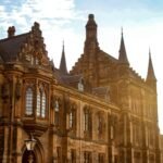 Stunning Gothic architectural detail of the University of Glasgow in bright sunlight.