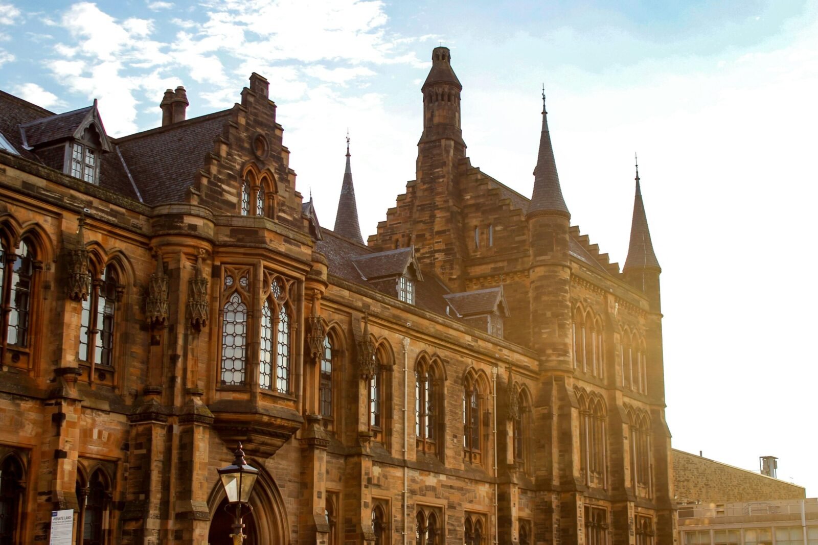 Stunning Gothic architectural detail of the University of Glasgow in bright sunlight.